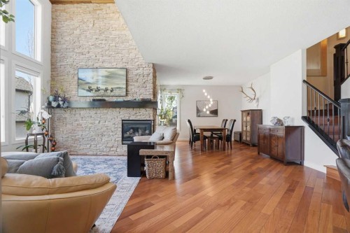 135 Cranleigh View Se, Calgary, AB - Indoor Photo Showing Living Room With Fireplace