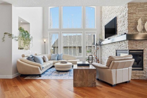 135 Cranleigh View Se, Calgary, AB - Indoor Photo Showing Living Room With Fireplace