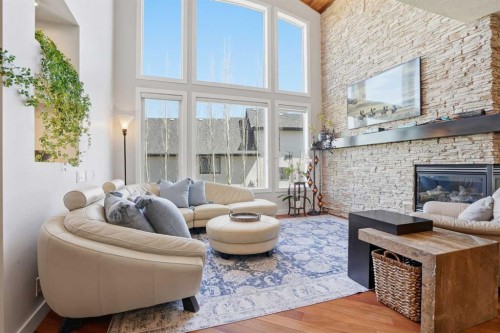 135 Cranleigh View Se, Calgary, AB - Indoor Photo Showing Living Room With Fireplace