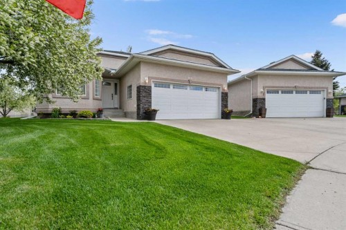 310 Riverside Garden Nw, High River, AB - Outdoor With Facade