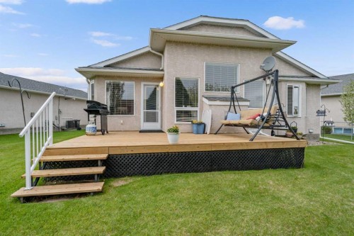 310 Riverside Garden Nw, High River, AB - Outdoor With Deck Patio Veranda