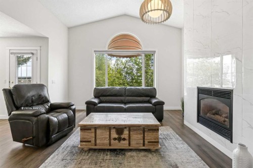 147 Hamptons Heath Nw, Calgary, AB - Indoor Photo Showing Living Room With Fireplace