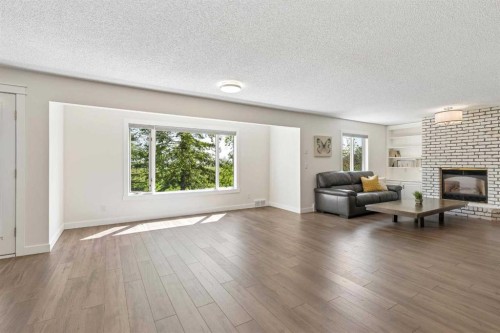 147 Hamptons Heath Nw, Calgary, AB - Indoor Photo Showing Living Room With Fireplace
