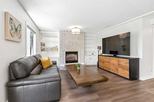 147 Hamptons Heath Nw, Calgary, AB - Indoor Photo Showing Living Room With Fireplace