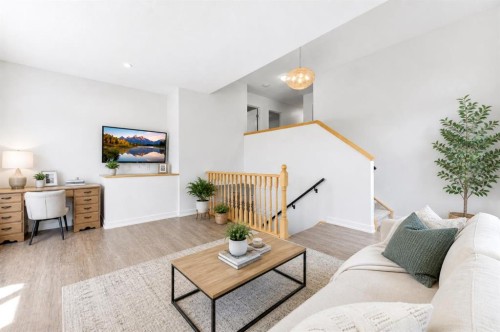 207 Gleneagles View, Cochrane, AB - Indoor Photo Showing Living Room
