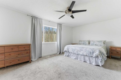 207 Gleneagles View, Cochrane, AB - Indoor Photo Showing Bedroom