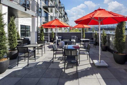 406-255 Les Jardins Park Se, Calgary, AB - Outdoor With Balcony