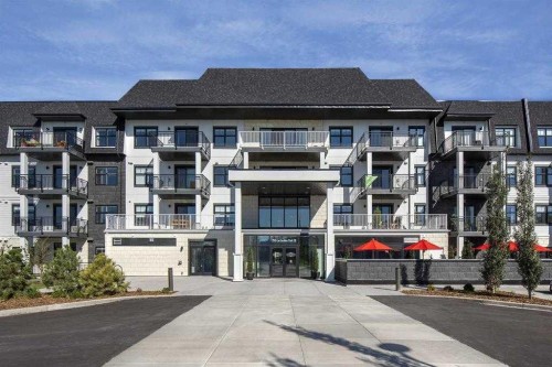 406-255 Les Jardins Park Se, Calgary, AB - Outdoor With Balcony With Facade