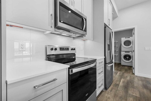 406-255 Les Jardins Park Se, Calgary, AB - Indoor Photo Showing Kitchen With Stainless Steel Kitchen