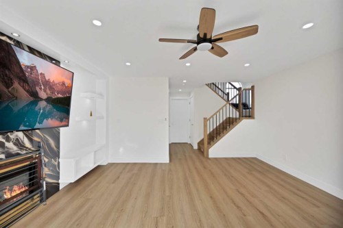100 San Diego Green Ne, Calgary, AB - Indoor Photo Showing Other Room With Fireplace