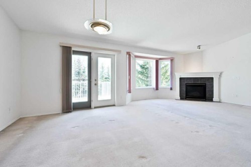 184 Valley Ridge Heights Nw, Calgary, AB - Indoor Photo Showing Living Room With Fireplace