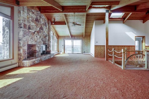 273167 Range Road 25, Rural Rocky View County, AB - Indoor Photo Showing Other Room With Fireplace