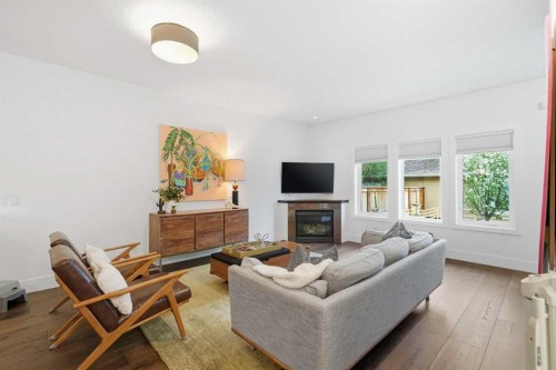 226 11 Avenue Nw, Calgary, AB - Indoor Photo Showing Living Room With Fireplace