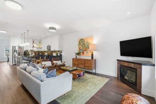 226 11 Avenue Nw, Calgary, AB - Indoor Photo Showing Living Room With Fireplace