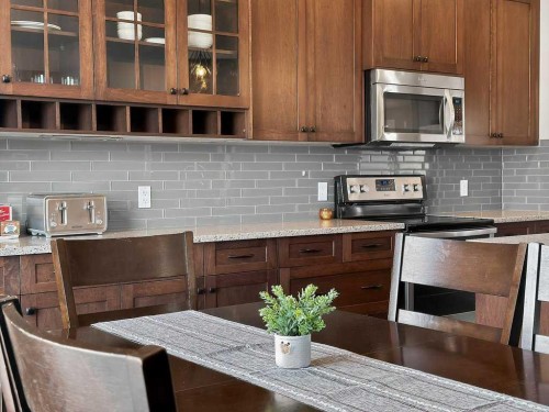 76 Rainbow Falls Boulevard, Chestermere, AB - Indoor Photo Showing Kitchen With Upgraded Kitchen