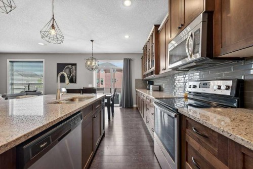 76 Rainbow Falls Boulevard, Chestermere, AB - Indoor Photo Showing Kitchen With Upgraded Kitchen