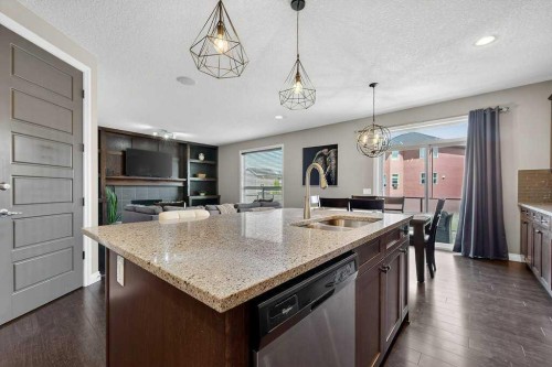 76 Rainbow Falls Boulevard, Chestermere, AB - Indoor Photo Showing Kitchen With Double Sink With Upgraded Kitchen