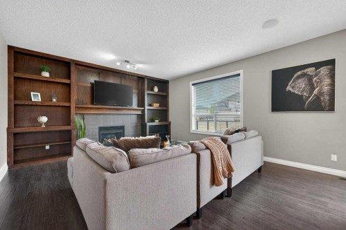 76 Rainbow Falls Boulevard, Chestermere, AB - Indoor Photo Showing Living Room With Fireplace