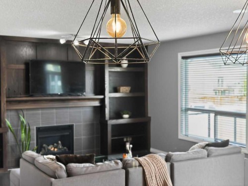 76 Rainbow Falls Boulevard, Chestermere, AB - Indoor Photo Showing Living Room With Fireplace