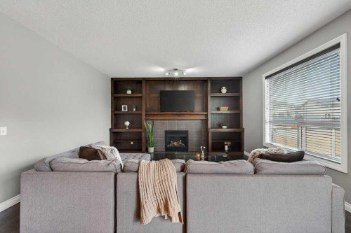 76 Rainbow Falls Boulevard, Chestermere, AB - Indoor Photo Showing Living Room With Fireplace