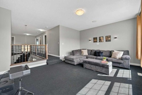 76 Rainbow Falls Boulevard, Chestermere, AB - Indoor Photo Showing Living Room