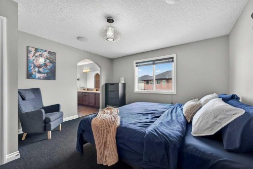 76 Rainbow Falls Boulevard, Chestermere, AB - Indoor Photo Showing Bedroom