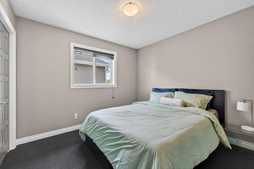 76 Rainbow Falls Boulevard, Chestermere, AB - Indoor Photo Showing Bedroom