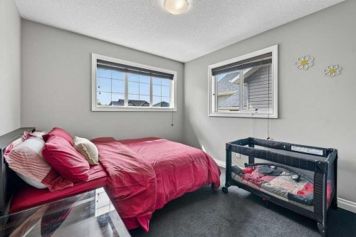 76 Rainbow Falls Boulevard, Chestermere, AB - Indoor Photo Showing Bedroom