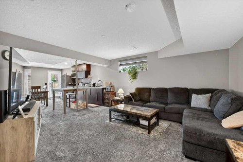 76 Rainbow Falls Boulevard, Chestermere, AB - Indoor Photo Showing Living Room