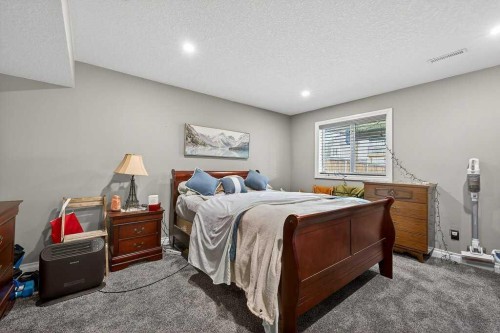 76 Rainbow Falls Boulevard, Chestermere, AB - Indoor Photo Showing Bedroom