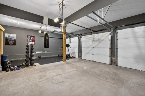 76 Rainbow Falls Boulevard, Chestermere, AB - Indoor Photo Showing Garage