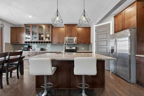 76 Rainbow Falls Boulevard, Chestermere, AB - Indoor Photo Showing Kitchen With Upgraded Kitchen