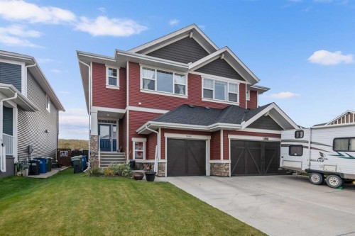 390 River Heights Crescent, Cochrane, AB - Outdoor With Facade