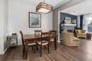 390 River Heights Crescent, Cochrane, AB  - Indoor Photo Showing Dining Room With Fireplace 