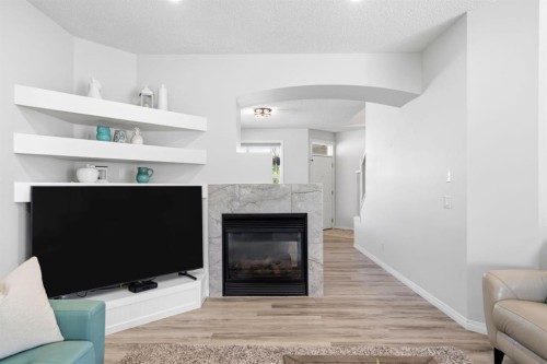 212 Willowmere Close, Chestermere, AB - Indoor Photo Showing Living Room With Fireplace