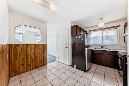 703 58 Street Se, Calgary, AB - Indoor Photo Showing Kitchen With Double Sink