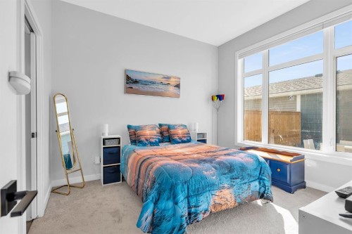 1098 Creekside Boulevard Sw, Calgary, AB - Indoor Photo Showing Bedroom