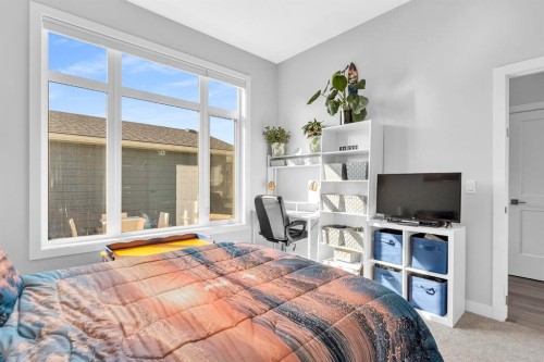 1098 Creekside Boulevard Sw, Calgary, AB - Indoor Photo Showing Bedroom