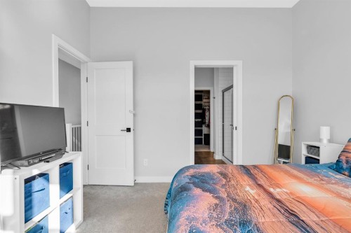 1098 Creekside Boulevard Sw, Calgary, AB - Indoor Photo Showing Bedroom
