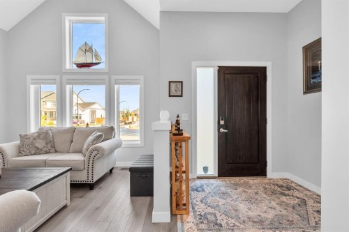 1098 Creekside Boulevard Sw, Calgary, AB - Indoor Photo Showing Living Room
