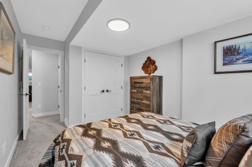 1098 Creekside Boulevard Sw, Calgary, AB - Indoor Photo Showing Bedroom