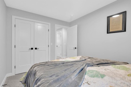 1098 Creekside Boulevard Sw, Calgary, AB - Indoor Photo Showing Bedroom