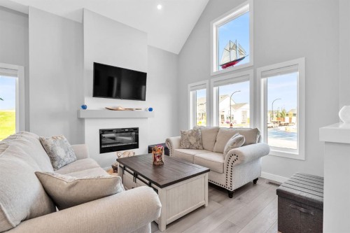1098 Creekside Boulevard Sw, Calgary, AB - Indoor Photo Showing Living Room With Fireplace