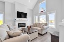 1098 Creekside Boulevard Sw, Calgary, AB  - Indoor Photo Showing Living Room With Fireplace 
