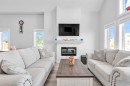 1098 Creekside Boulevard Sw, Calgary, AB  - Indoor Photo Showing Living Room With Fireplace 