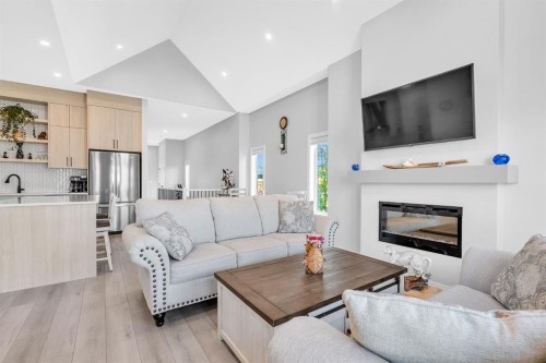 1098 Creekside Boulevard Sw, Calgary, AB - Indoor Photo Showing Living Room With Fireplace