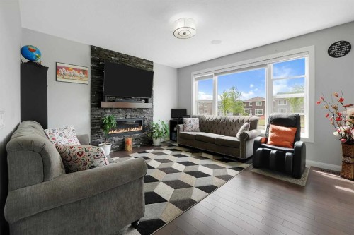 98 Red Sky Green Ne, Calgary, AB - Indoor Photo Showing Living Room With Fireplace