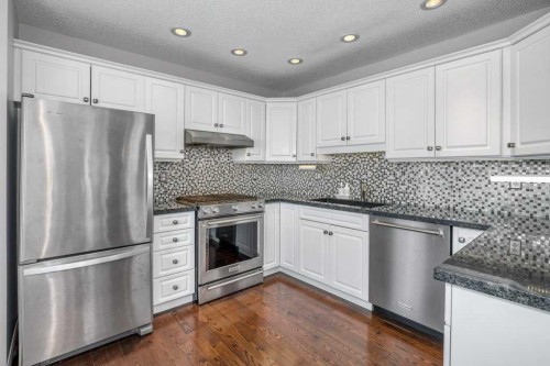 31-8 Riverview Circle, Cochrane, AB - Indoor Photo Showing Kitchen With Stainless Steel Kitchen With Upgraded Kitchen