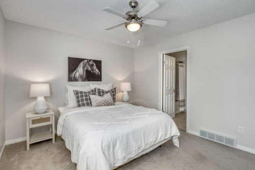 31-8 Riverview Circle, Cochrane, AB - Indoor Photo Showing Bedroom