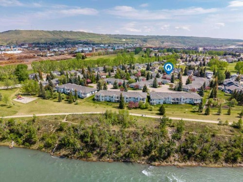 31-8 Riverview Circle, Cochrane, AB - Outdoor With Body Of Water With View